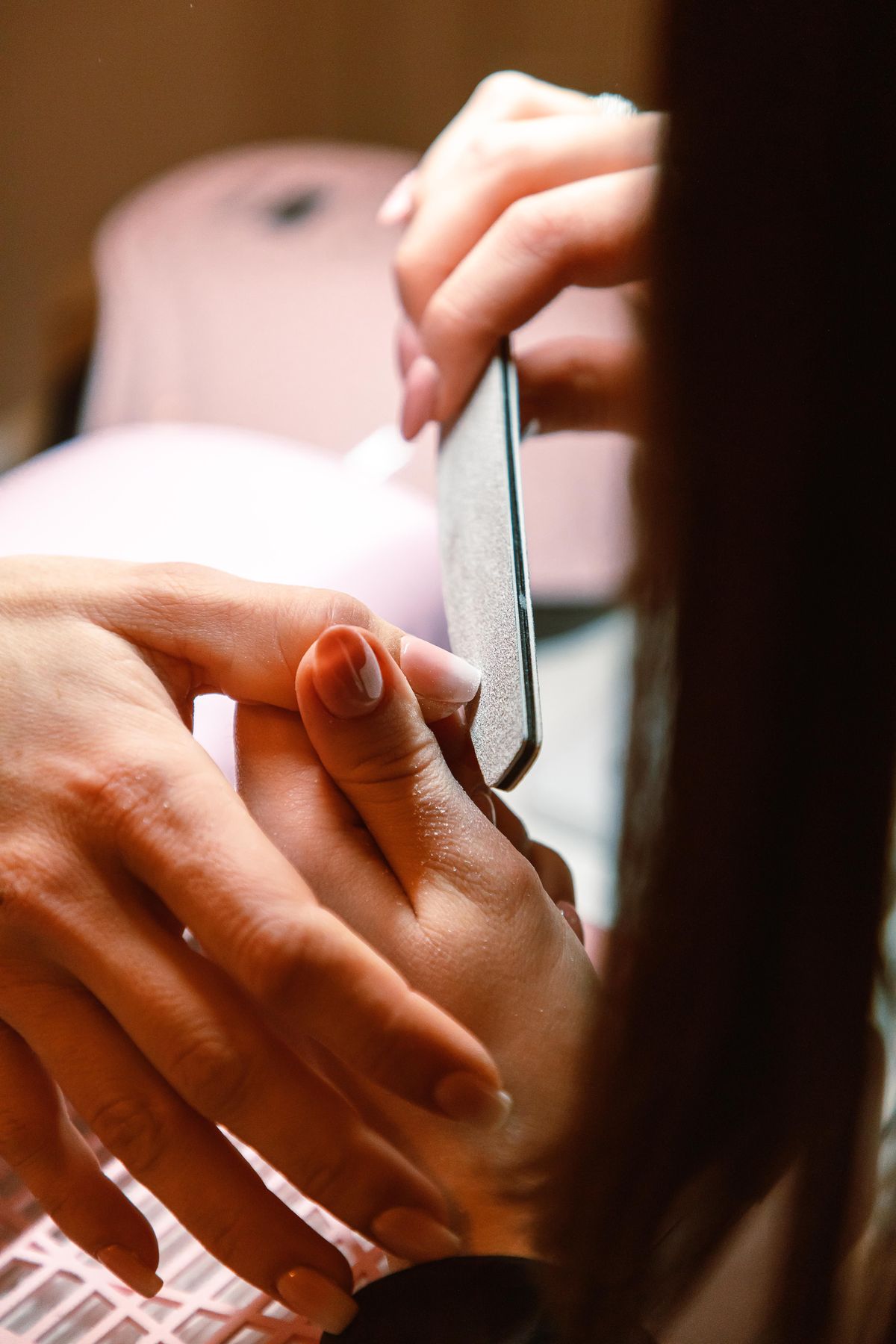 Client receiving a nail treatment