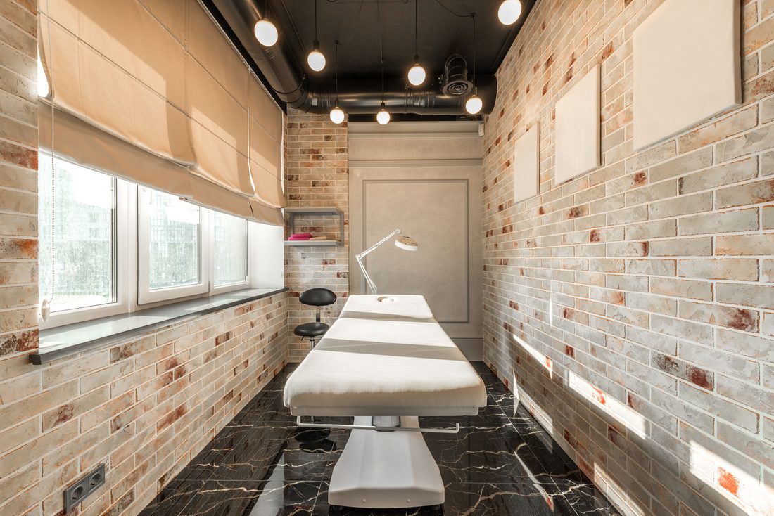 A massage table in a treatment room